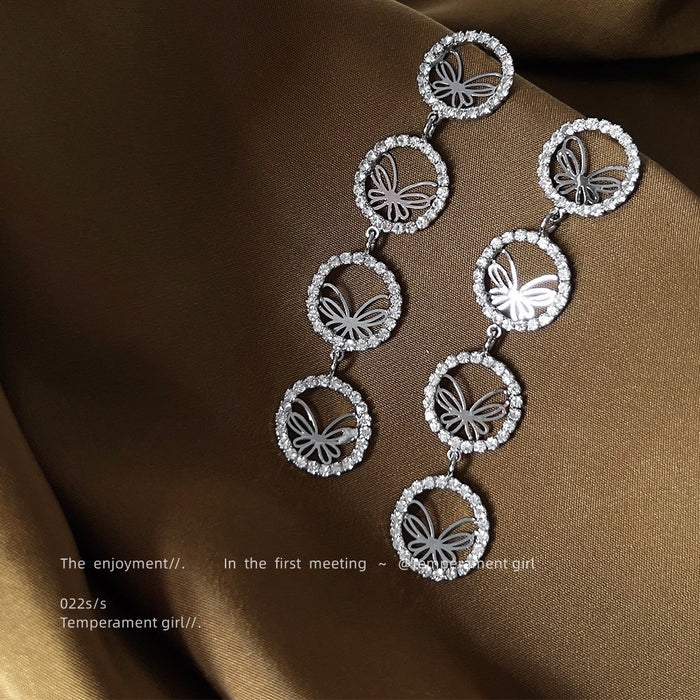 Silver Pave Butterfly Four Disc Long Drop Earrings