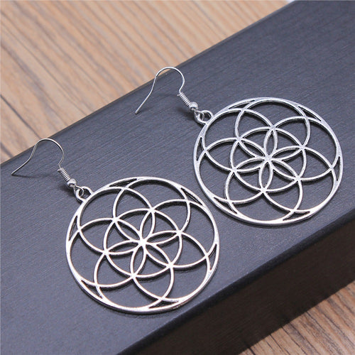 Front display of circle flower earrings on a light background