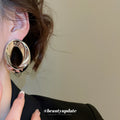 Silver Tone Sculpted Oval Statement Stud Earrings With Polished Metal Details view 3
