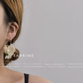 Gold Tone Oval Loop White Flower Green Leaf Iridescent Drop Earrings view 2