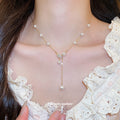 Gold Tone Pearl Leaf Y Drop Necklace With Decorative Details view 1