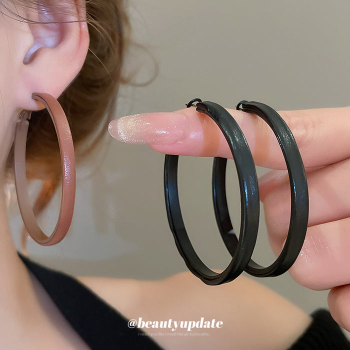 Slim Leather Hoop Earrings in Black and Brown with Polished Details