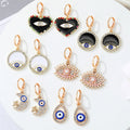 Gold Tone Ornate Crystal Evil Eye Huggie Drop Earrings in Seven Designs view 1