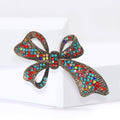 Red Crystal Long Tail Bow Brooch with Gold Tone Frame view 2