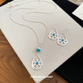 Silver Teardrop Flower Earrings and Pendant Necklace view 2