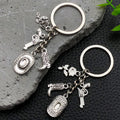 Antique Silver Cowboy Hat Boot and Pistol Keychain Set view 1