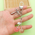 Cherry Charm Keychains Featuring Pink Cherry Across 28 Pictured Variations view 2