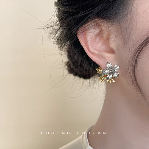 Two-tone leaf stud worn on ear side profile