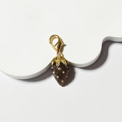 Close-up showing the colors and surface details of gold Tone Pearl-Dotted Strawberry Lobster-Clasp Charms in Four Colors