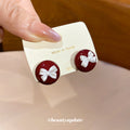 Burgundy Round Stud Earrings With White Bow Accents view 2