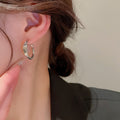 Metal Hoop Earrings in Gold and Silver with Varied Textures view 3