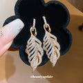 Crystal Leaf Drop Earrings with Detailed Gold Tone Openwork view 1