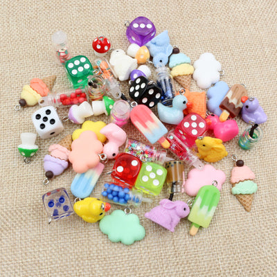 Overview of a colorful assortment of miniature dice, desserts, rabbits, mushrooms, and other playful shapes