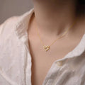 Interlocking Double Heart Pendant Necklace In Gold And Silver Tones view 3