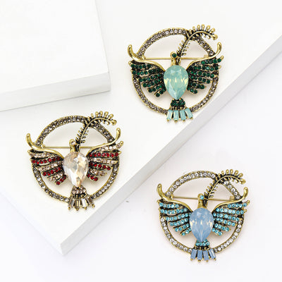 Circular Crystal Owl Brooch shown against a white display background