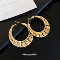 Textured Gold Tone Wide Hoop Earrings with Cutout Details view 1