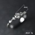 Lace-Edge Band And Three-Stone Solitaire Ring Options In Two Tones view 5