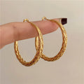 Gold Tone Braided Raised Texture Medium Hoop Earrings view 3