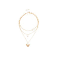 Layered Heart Pendant Necklace In Gold And Silver With Three Fine Chains view 5