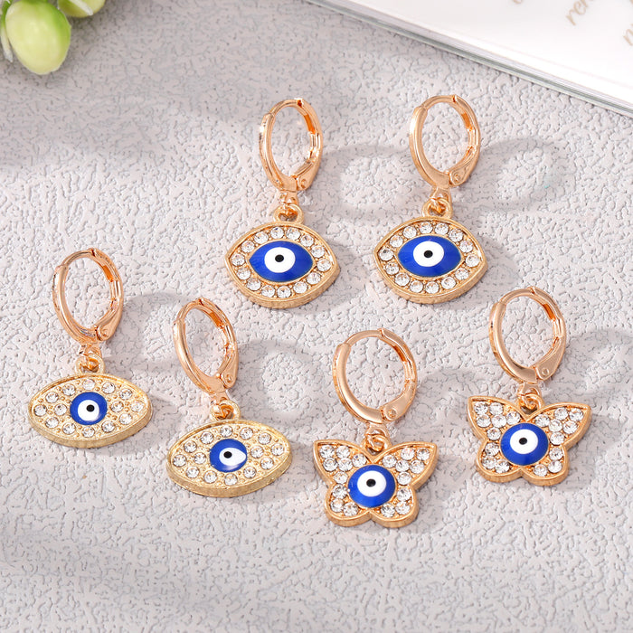 Gold Tone Crystal Blue Evil Eye Huggie Earrings in Three Shapes