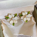 White Layered Flower Stud Earrings With Gold Tone Edges view 2