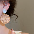 Woven Rattan Circle and White Cabochon Earrings with Decorative Details view 3