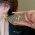 Open Bow Wire Hoop Earrings in Gold and Silver Tone view 3