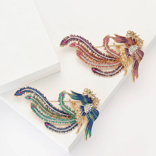 Front view of the jeweled long tail phoenix brooch and its color options