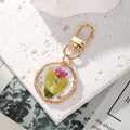 Gold Tone Pressed Flower Round and Ice Cream Clip Keychains view 2