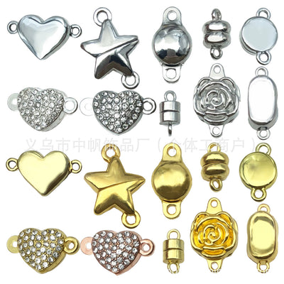 Yellow lobster clasp jewelry findings arranged on a light background