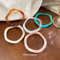 Five White Cream Teal Pink And Brown Irregular Resin Bangles view 2