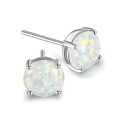 Pair of round faux opal studs showing posts and prongs