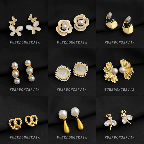 Grid gold shell camellia pearl bow ballet clip earrings