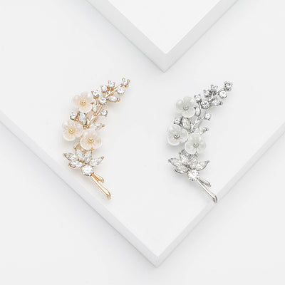 Pearl Blossom Branch Brooch shown against a white display background