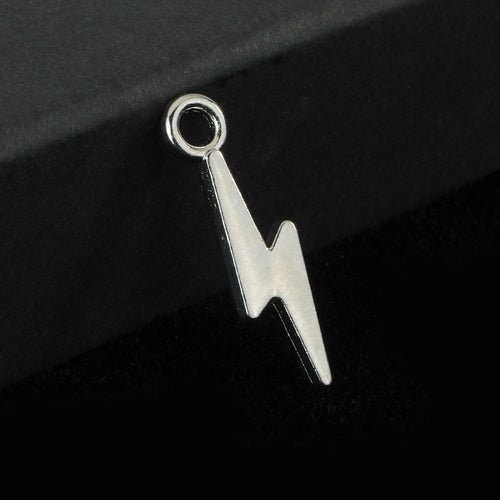 Silver-tone lightning bolt charm with a hanging loop