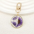 Gold Tone Round Pressed Daisy Resin Clip Keychains view 8