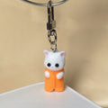 Flocked White Cat Clip Keychains in Nine Outfit Colors view 7