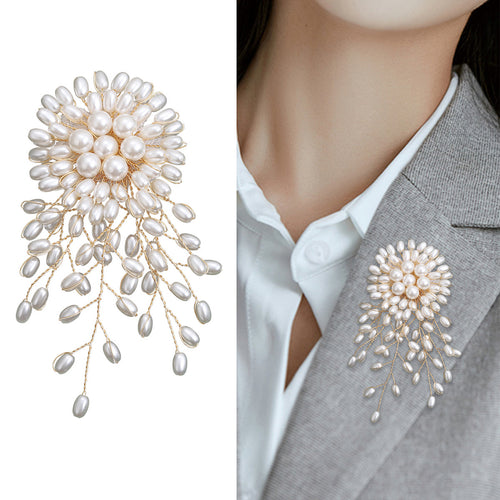 pearl spray flower brooch displayed on a product backdrop