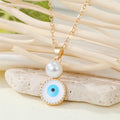 Gold Tone White Evil Eye Pendant Necklaces in Two Drop Designs view 2