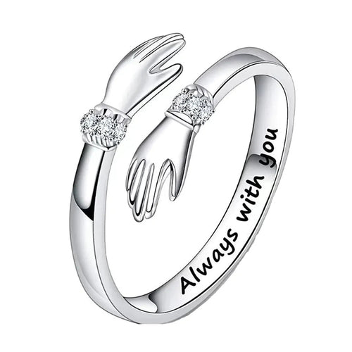 Product view showing engraved hugging hands adjustable ring