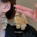 Layered Metal Petal Hook Earrings In Gold And Silver view 1