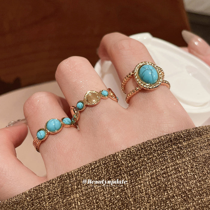 Gold Open Ring Oval Blue Stone Twisted Rope Border