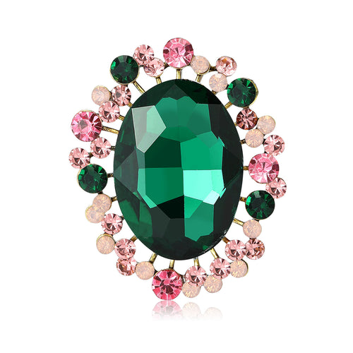 Green oval glass center brooch with pink green halo front view