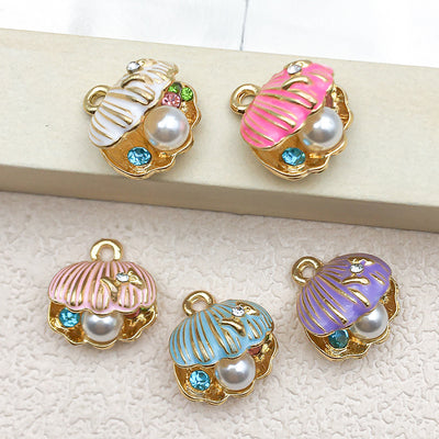 Colorful seashell charms arranged on a light background