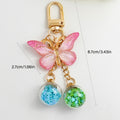 Pink Ombre Glitter Butterfly Keychain With Two Star Confetti Globes view 4