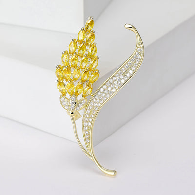Product image 1 showing the golden wheat ear brooch with clear crystal curved leaf.