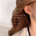 Gold Tone Mini Huggie Hoop Earrings Baguette Zircon Accent view 3