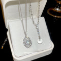 Silver Tone Oval Crystal Halo Pendant Necklace with Detailed Finish view 2