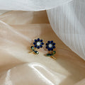 Red Rhinestone Flower Stem Stud Earrings Gold Leaf Accents view 3