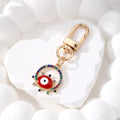 Gold Tone Rhinestone Round Evil Eye Clip Keychains in Six Colors view 2